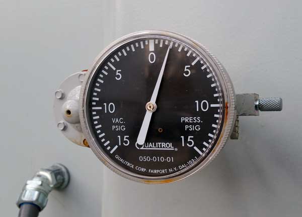 Transformer pressure/vacuum gauges indicate the integrity of the sealed tank construction.